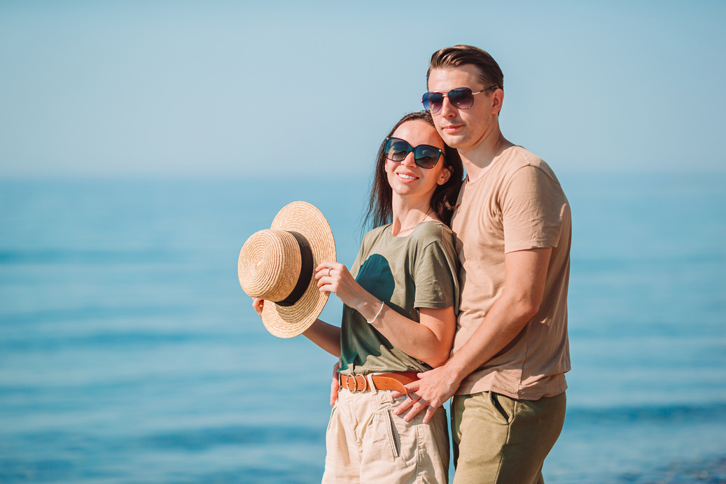 Young Couple on White Beach during Summer Vacation.